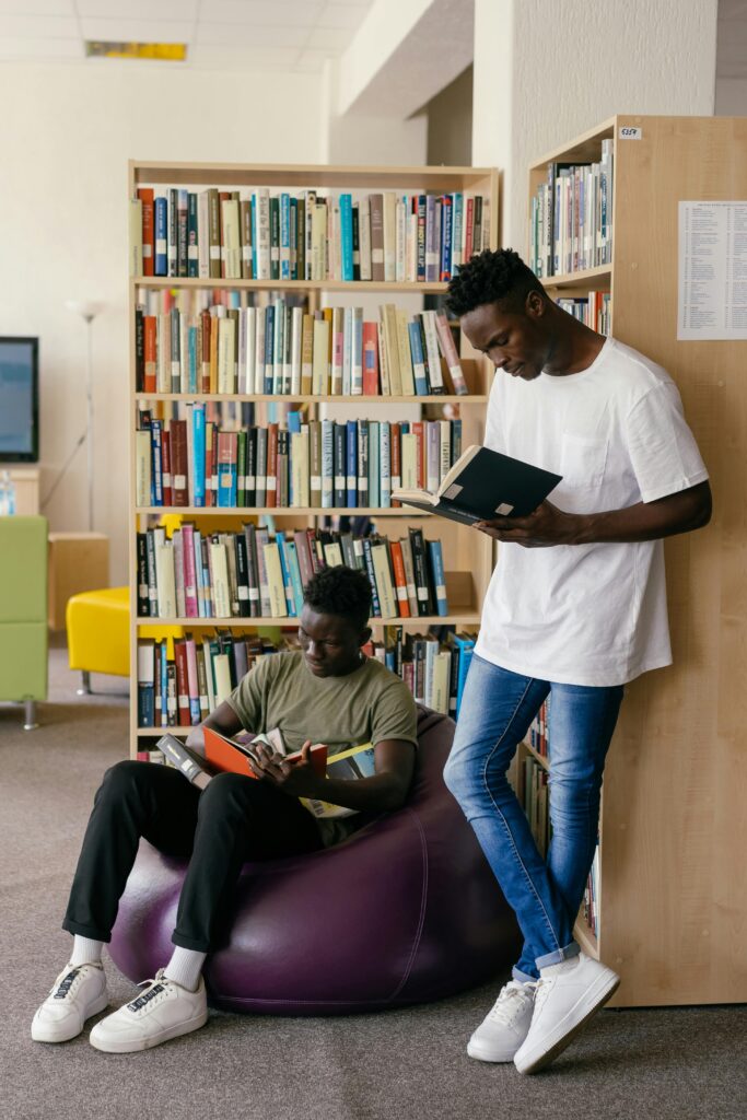 students-library Two adult students are reading in library.