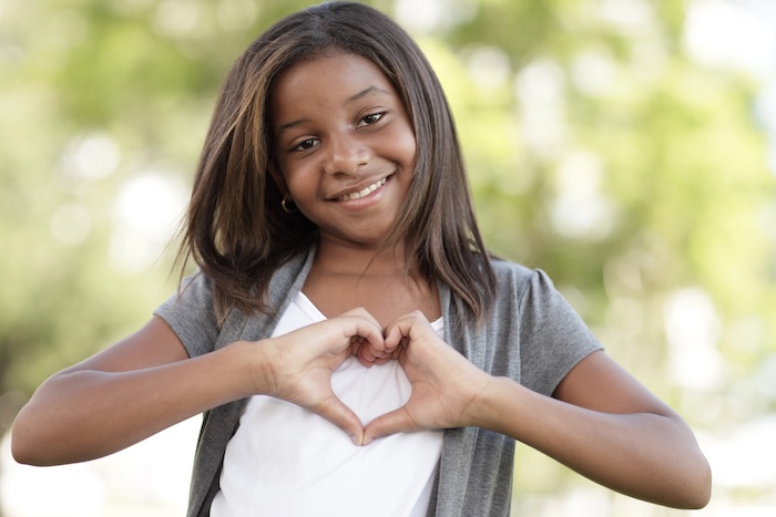 Heart shape hand Girl making a heart shape hand gesture