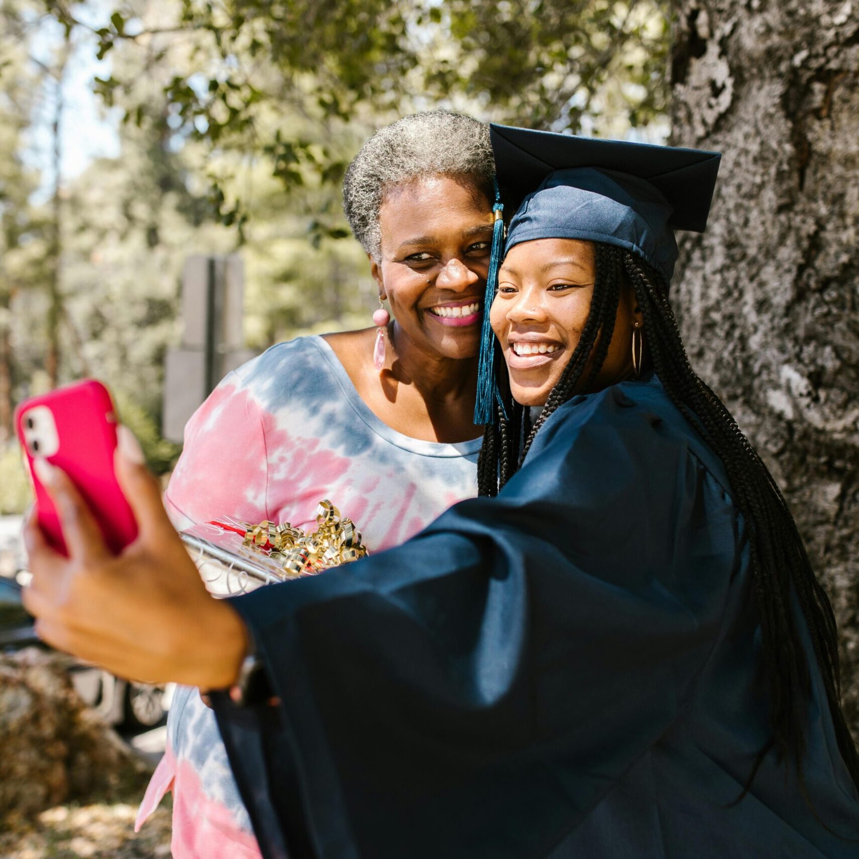 A graduate takes a selfie with grandma